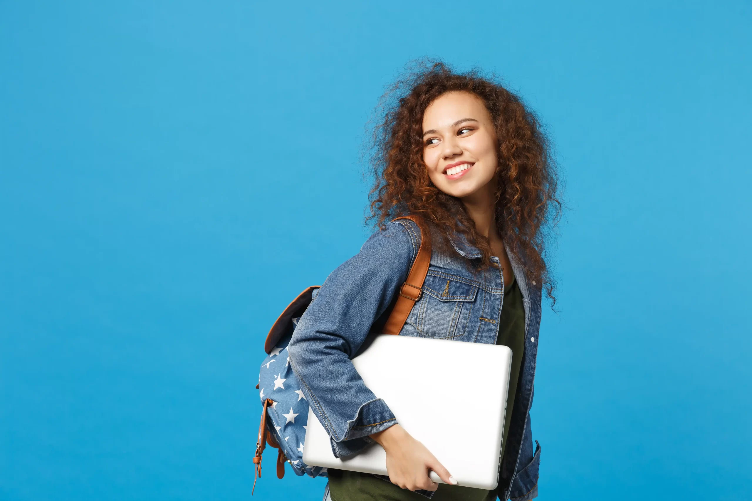 Student with laptop and carry bag
